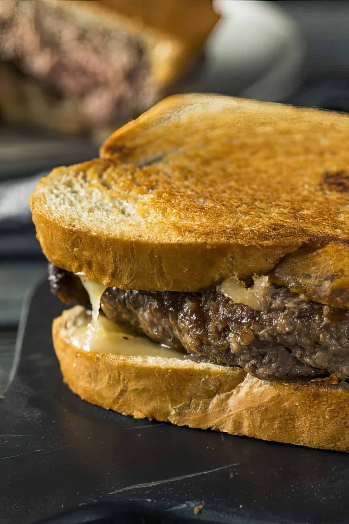 Love this easy patty melt recipe. Juicy and bursting with flavor with the addition of buttery sauteed onions and cheese. #misshomemade